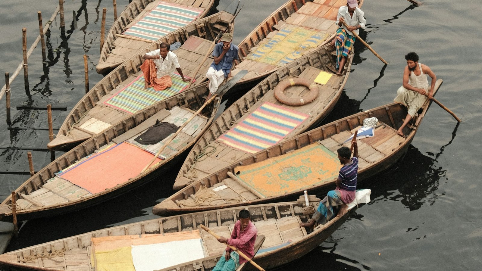Colourful wooden boats moored on a river in Bangladesh