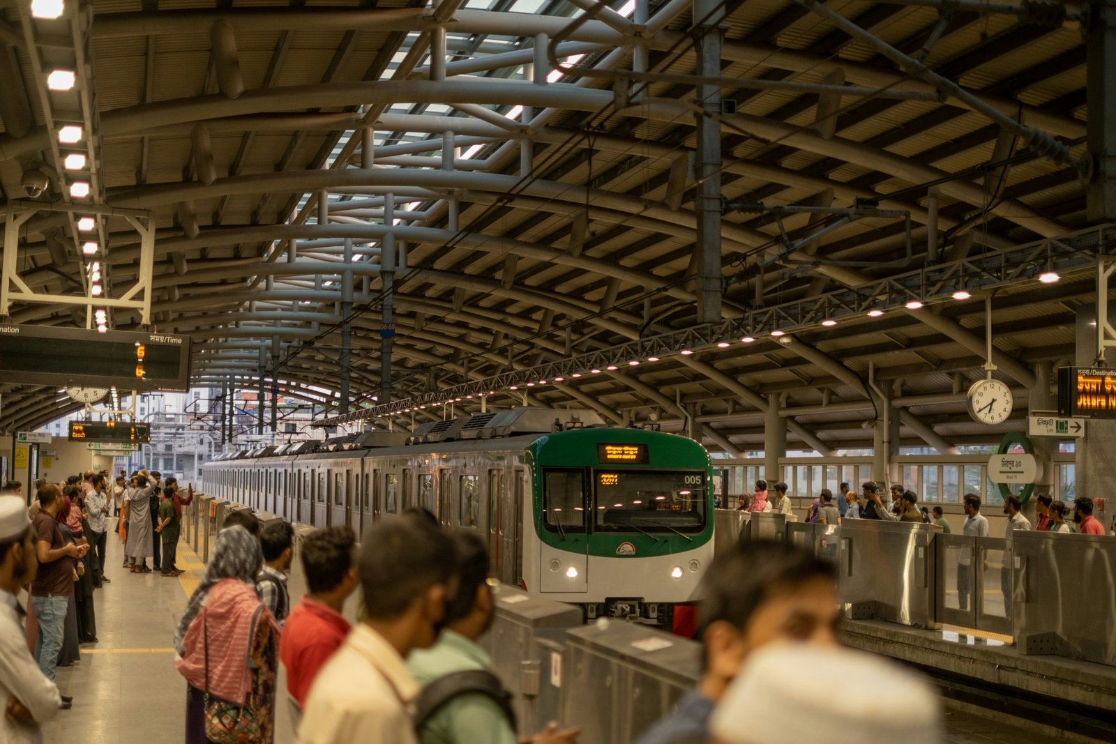 Commuters waiting on a Dhaka metro rail platform