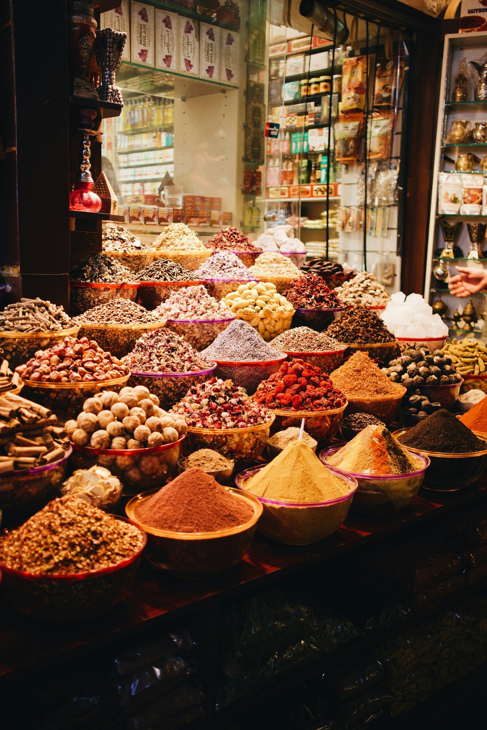 A spice stall piled with whole and ground spices